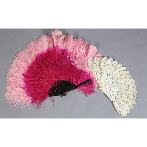 48 - A large ostrich feather fan in vibrant cerise, the tips in rose pink, mounted on tortoiseshell, heig... 