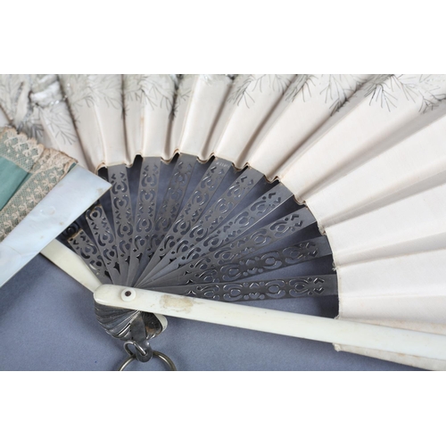 5 - A large c 1890’s folding fan, the monture a mix of bone to the guards and pierced metal to the gorge... 