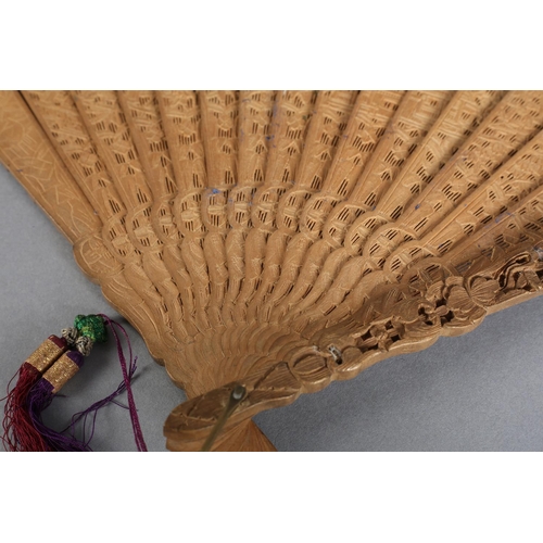 53 - A Chinese carved sandalwood brisé fan, Qing Dynasty, with fourteen inner sticks and two the guards v... 