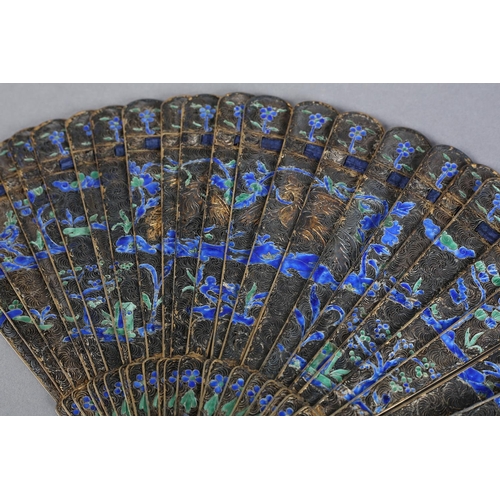 59 - A Canton Chinese filagree silver-gilt metal and enamel brisé fan, c 1830, the design of buildings fl... 