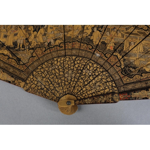 60 - A Chinese lacquer brisé fan, Qing dynasty, nineteen inner sticks and two guards, the black lacquer d... 