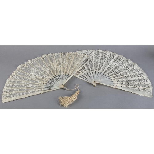 7 - Two white mother of pearl and Belgian lace fans, late 19th century, the first with Bobbin lace leaf,... 