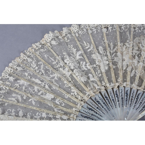 7 - Two white mother of pearl and Belgian lace fans, late 19th century, the first with Bobbin lace leaf,... 