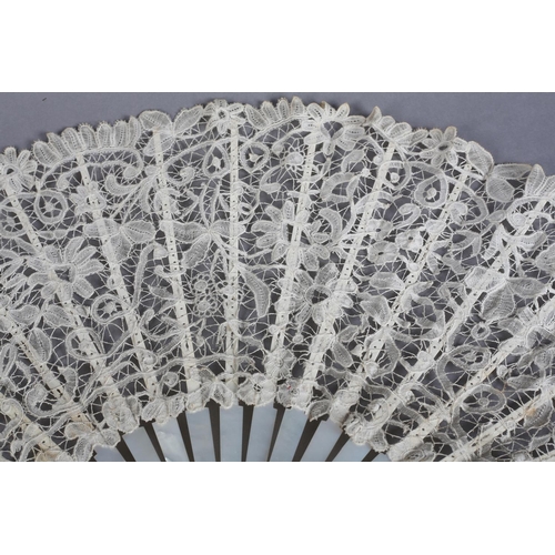 7 - Two white mother of pearl and Belgian lace fans, late 19th century, the first with Bobbin lace leaf,... 