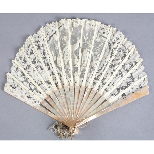 8 - A small Brussels mixed lace fan of fontange form, the leaf mounted on pink mother of pearl, a centra... 