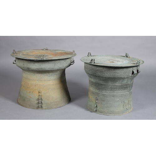 80 - A PAIR OF BURMESE BRONZE RAIN DRUMS, possibly 19th century of graduated size, finely cast, the patin... 