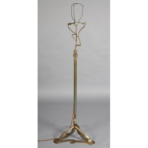 97 - AN ART NOUVEAU BRASS STANDARD LAMP having an open swept basket on a telescopic column and tripod bas... 