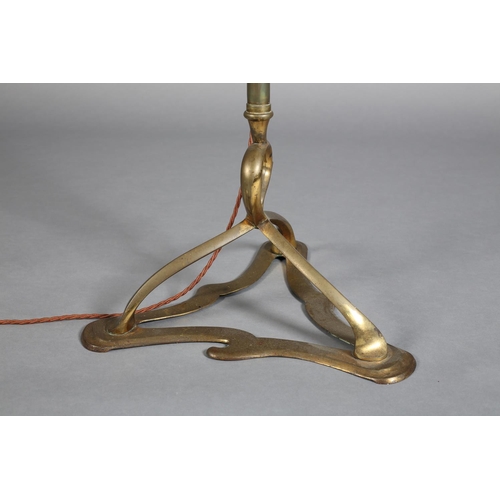 97 - AN ART NOUVEAU BRASS STANDARD LAMP having an open swept basket on a telescopic column and tripod bas... 