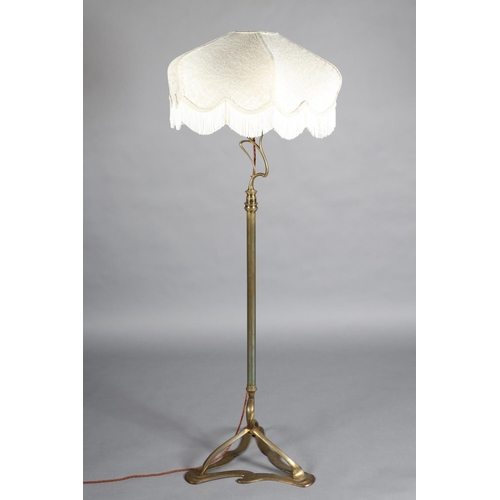 97 - AN ART NOUVEAU BRASS STANDARD LAMP having an open swept basket on a telescopic column and tripod bas... 