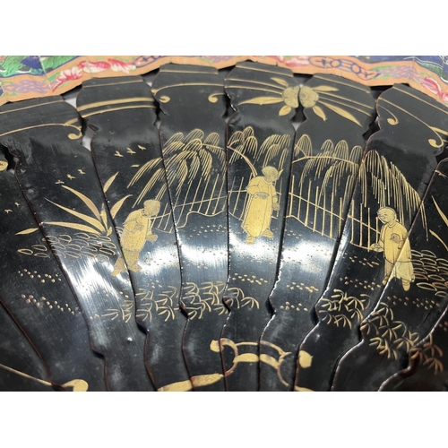 54 - A mid-19th century Chinese Mandarin fan, the monture lacquered in black and painted in gold, the dou... 