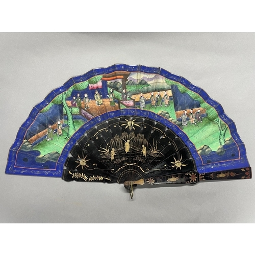 54 - A mid-19th century Chinese Mandarin fan, the monture lacquered in black and painted in gold, the dou... 