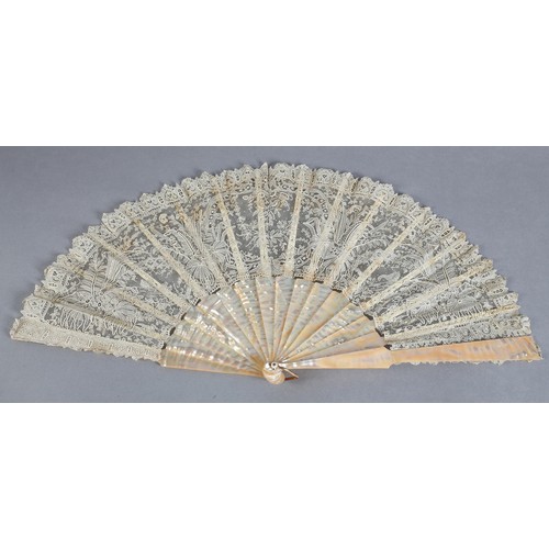 28 - C 1880's, a good Brussels needle lace fan, Point de Gaze, with unusual design features, being large ... 