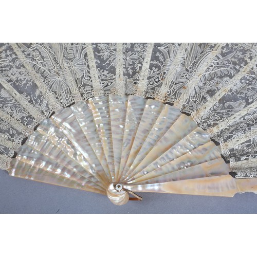 28 - C 1880's, a good Brussels needle lace fan, Point de Gaze, with unusual design features, being large ... 