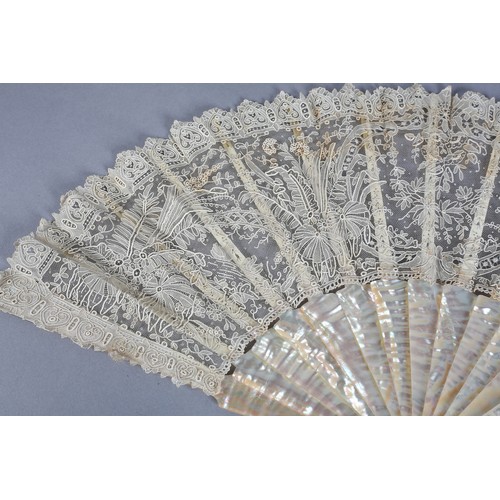 28 - C 1880's, a good Brussels needle lace fan, Point de Gaze, with unusual design features, being large ... 