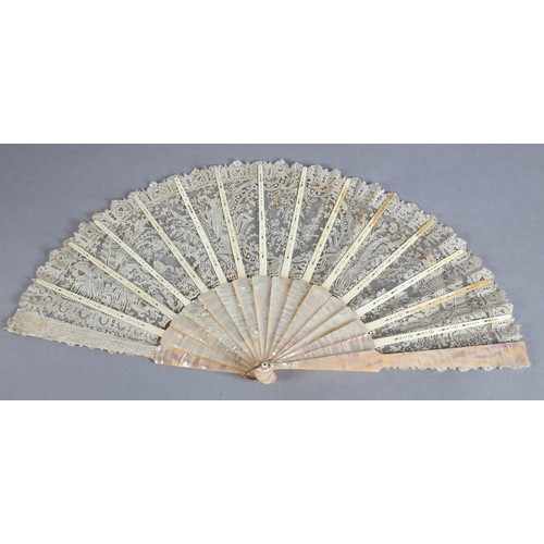 28 - C 1880's, a good Brussels needle lace fan, Point de Gaze, with unusual design features, being large ... 