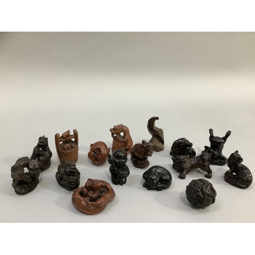 83 - A group of 16 carved hardwood figures and netsuke including mythological and natural depiction