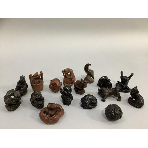 83 - A group of 16 carved hardwood figures and netsuke including mythological and natural depiction