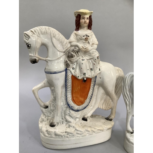 15 - Two Staffordshire equestrian figures, Scotsman titled 'Peace', the other a young girl holding a lamb... 