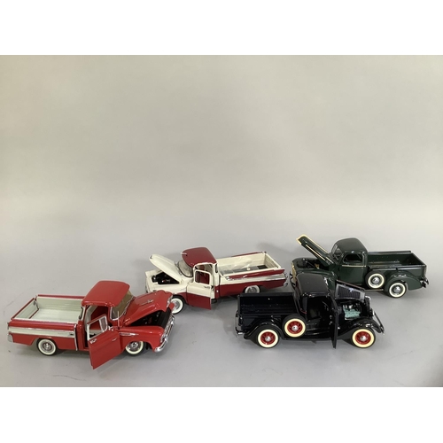 26 - Four Danbury mint diecast models of 1957 Dodge swept side d100, a 1935 Ford pick-up, a 1942 pick-up ... 