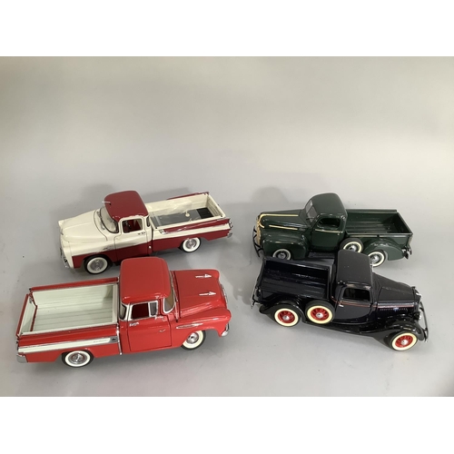 26 - Four Danbury mint diecast models of 1957 Dodge swept side d100, a 1935 Ford pick-up, a 1942 pick-up ... 