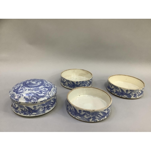 29 - A 19th century Chinese blue and white four stacking rice bowls and cover, painted with ornate birds ... 