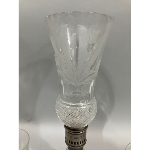 7 - An Edinburgh Crystal cut glass candle lamp of thistle shape and etched with thistles, 35cm high toge... 