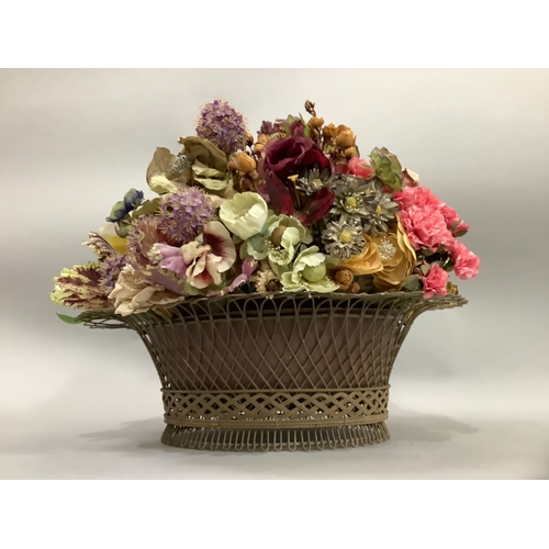 3 - An oval wirework basket with liner, 50cm wide x 17cm high, with a display of flowers