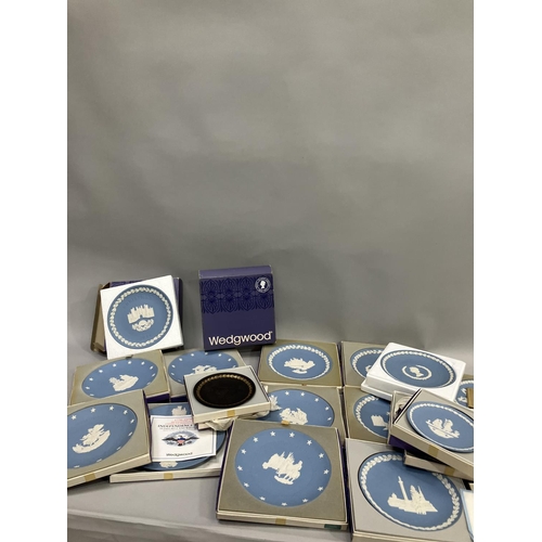 106 - A collection of Wedgwood Jasperware, mainly in blue, and including American Independence, Christmas,... 