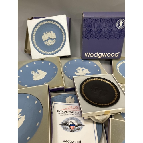 106 - A collection of Wedgwood Jasperware, mainly in blue, and including American Independence, Christmas,... 