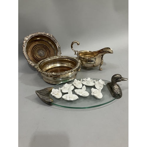 68 - A pair of silver plated wine coasters with gadroon rims, a saucer boat on three pad feet, a pewter a... 