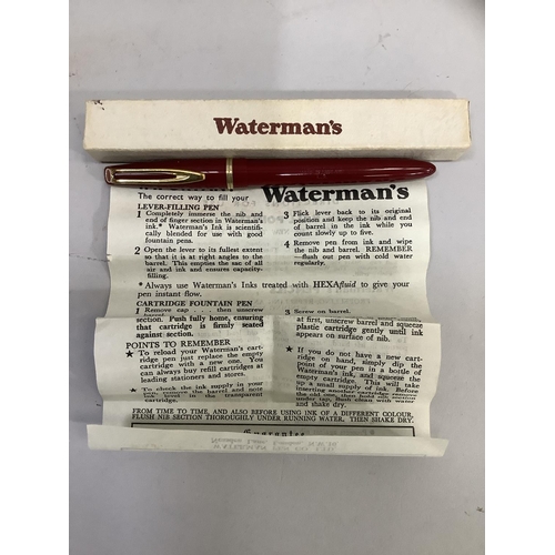 9 - A vintage Waterman fountain pen, maroon case with gilt metal clip and band, stamped: Watermans L2 14... 