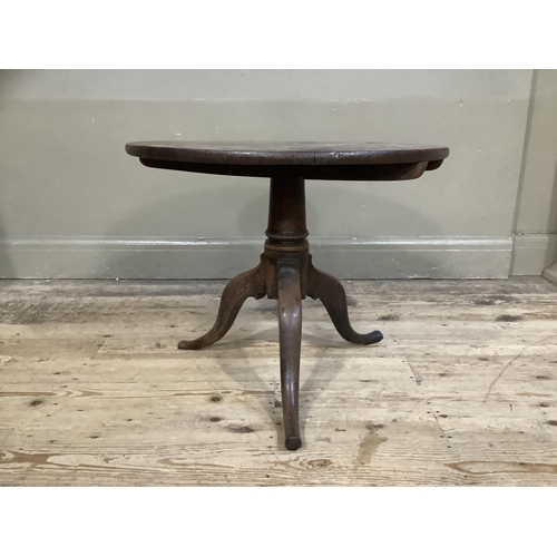 480 - A 19th Century oak circular tripod table, the column has been reduced, 60cm diameter