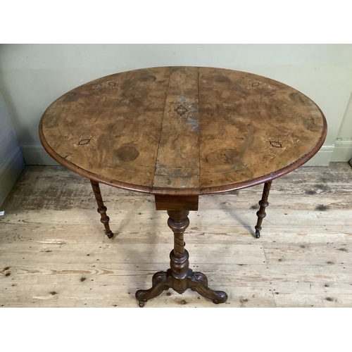 481 - A Victorian figured walnut oval gate legged table inlaid in satin wood and ebony with stringing and ... 