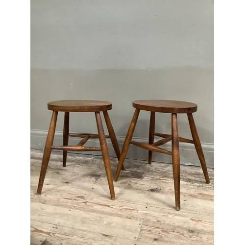 486 - A pair of Cryercraft elm stools, oval seats on rounded legs