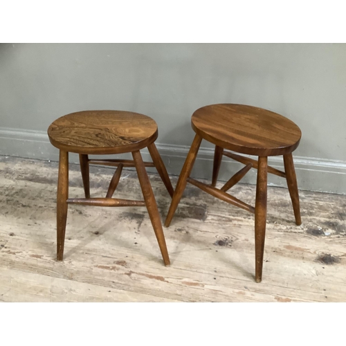 486 - A pair of Cryercraft elm stools, oval seats on rounded legs