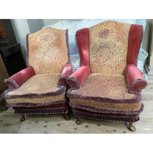 497 - An early 20th century triple arched back sofa, a pair of armchairs and a winged armchair all on the ... 