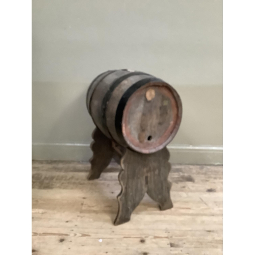 500 - An iron bound barrel on stand (no spigot), height of barrel 54cm x 35cm diameter