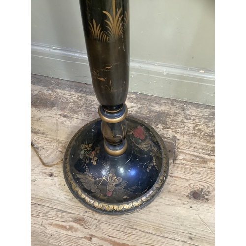 502 - An early 20th century chinoiserie lamp, black lacquer with vintage decoration together with shade