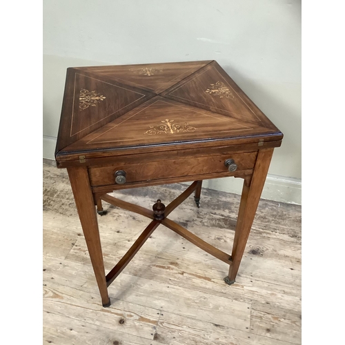 508 - An Edwardian rosewood and satinwood inlaid envelope card table, each triangular flap inlaid with scr... 