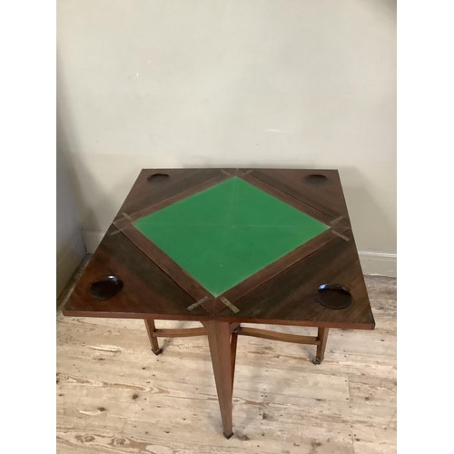 508 - An Edwardian rosewood and satinwood inlaid envelope card table, each triangular flap inlaid with scr... 