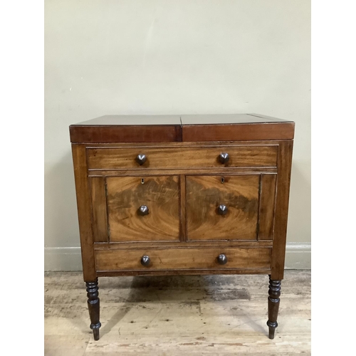 511 - An early twentieth century gentleman's washstand in mahogany, of Georgian design having twin fold ou... 