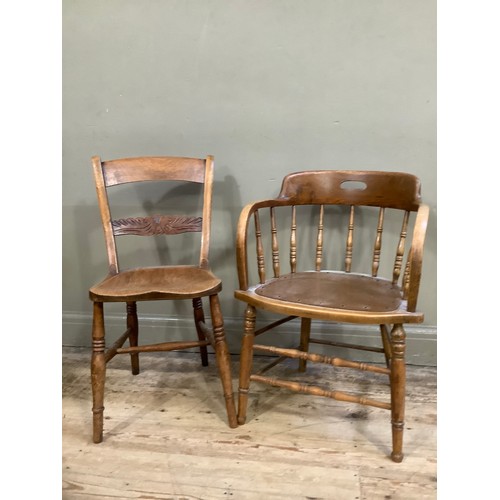 119 - A beech 1920's office chair with rail back and an elm chair  with carved back and turned legs