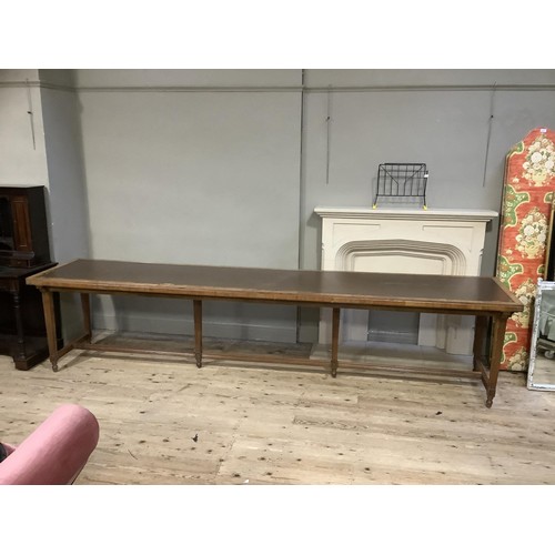 507 - 1920's/30's library table with incised leather surface, on square tapered and reeded legs joined by ... 