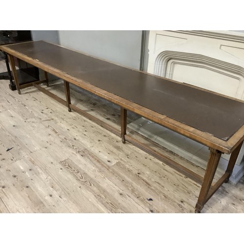 507 - 1920's/30's library table with incised leather surface, on square tapered and reeded legs joined by ... 