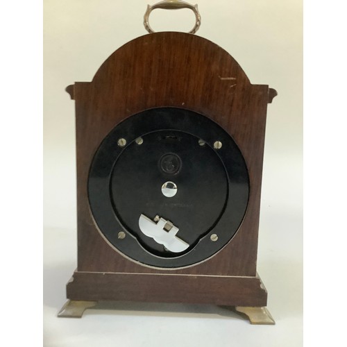 17 - A mahogany cased mantle clock, Tempus Fugit by Ogdens of Harrogate, brass dial with spoundrels, Roma... 