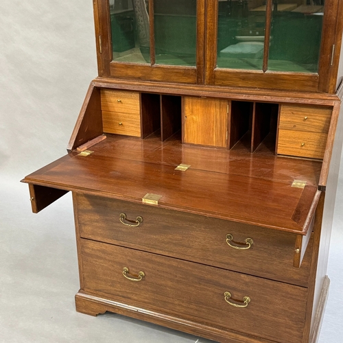 302 - A reproduction mahogany bureau bookcase originally fitted as a gun cabinet, now with painted green s... 