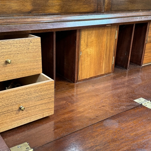 302 - A reproduction mahogany bureau bookcase originally fitted as a gun cabinet, now with painted green s... 