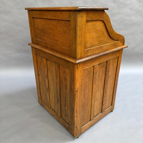 330 - An 1930/40s oak roll top desk having a roll top front, interior fitted with pigeon holes and documen... 