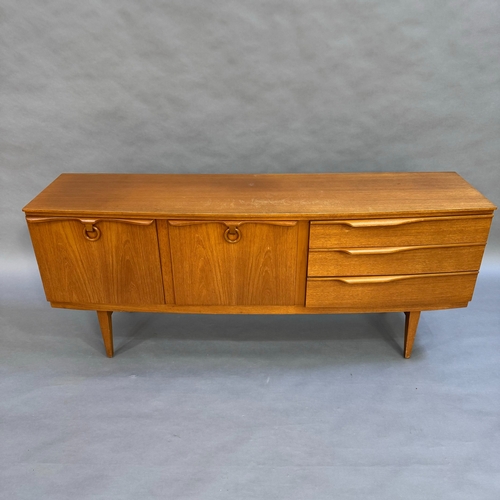 118 - A mid century teak sideboard, one door cupboard, one fall down front both having teak ring pull hand... 