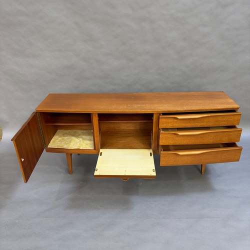 118 - A mid century teak sideboard, one door cupboard, one fall down front both having teak ring pull hand... 